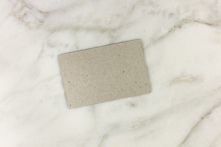 Grey card on white marble textureの写真素材