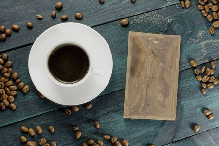 Coffee cup photo with grains and chocolateの写真素材