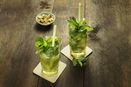 Mojito cocktails with mint leaves, lime and copyspaceの写真素材