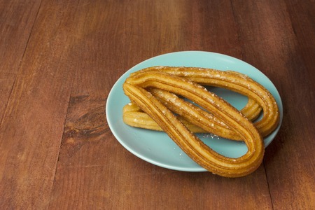 Traditional Spanish churros dessert with copyspaceの写真素材