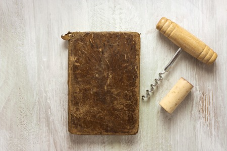 Old notebook, corkscrew, and cork, with copyspaceの写真素材