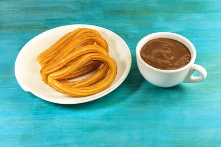Churros with hot chocolate, traditional Spanish breakfastの写真素材