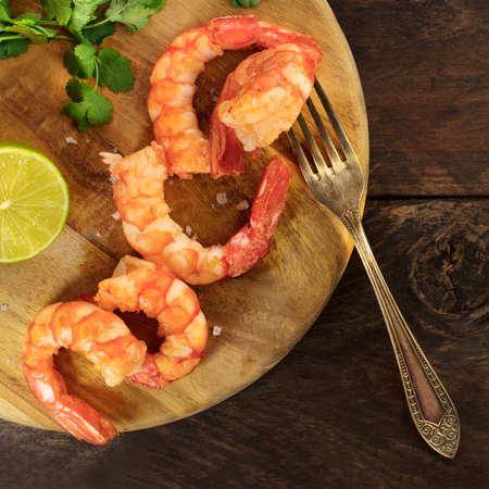 Cooked shrimps, slice of lime, cilantro leaves, copyspaceの写真素材