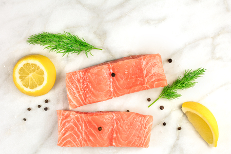 Photo of slices of salmon on white with copyspaceの写真素材