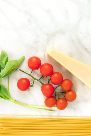 Basic pasta ingredients, including spaghetti and cheese