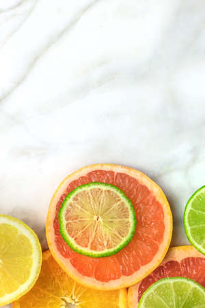 Grapefruit, lime, lemon, and orange slices with copyspaceの写真素材