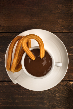 Photo of churros con chocolate, traditional Spanish dessertの写真素材