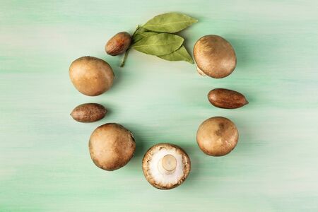 Portobello mushrooms with nuts, bay leaves, and copyspaceの写真素材