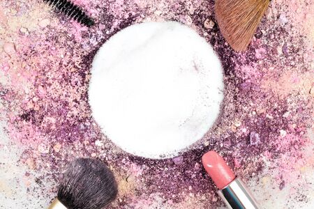 Makeup brushes, lipstick, and pencil with powder and copyspaceの写真素材