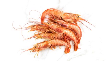 Raw shrimps on white marble table with copyspaceの写真素材