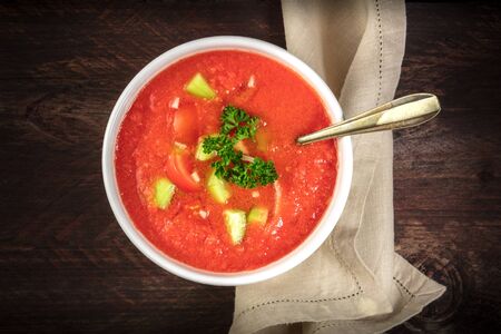 Bowl of gazpacho soup on rustic texture with copyspaceの写真素材