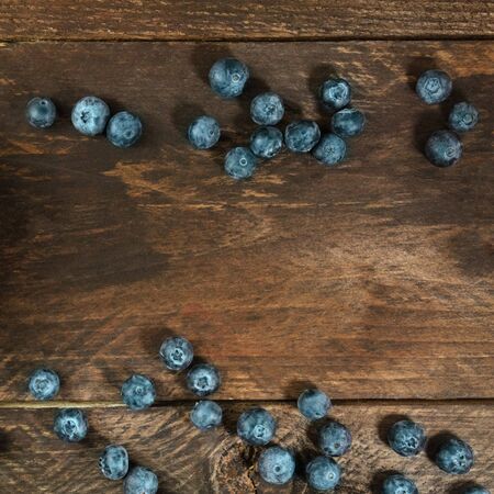 Fresh blueberries on rustic texture with copyspaceの写真素材