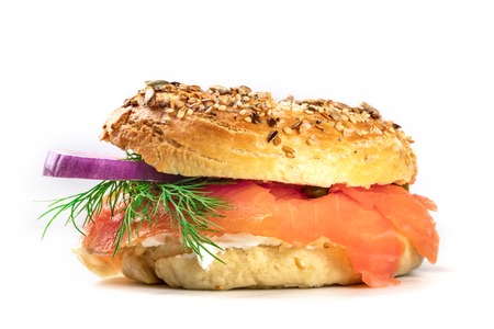 Sesame bagel with cream cheese and lox, on whiteの写真素材