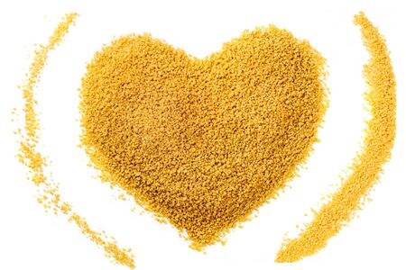 Heart made of couscous, shot from above on whiteの写真素材