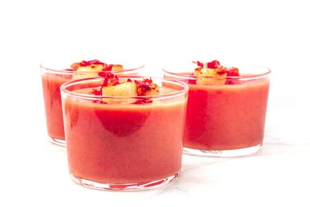 Salmorejo served in glasses on white with place for textの写真素材