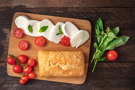 Caprese salad ingredients on rustic texture with copyspaceの写真素材