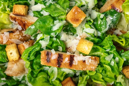 Closeup of chicken Caesar salad, overhead shotの写真素材