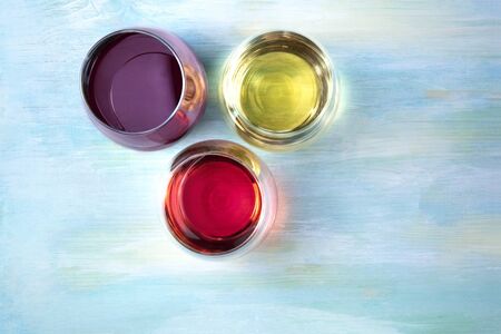 Red, white, and rose wine, overhead photo with copyspaceの写真素材