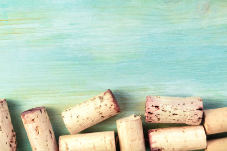 Vintage corks and corkscrew on teal with copy spaceの写真素材