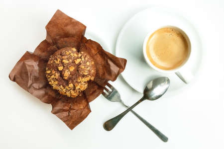 Chocolate muffin with coffee, overhead shot on whiteの写真素材