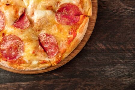 Cut pepperoni pizza with a place for textの写真素材
