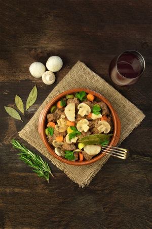 Overhead photo of meat and mushrooms ragout with wine