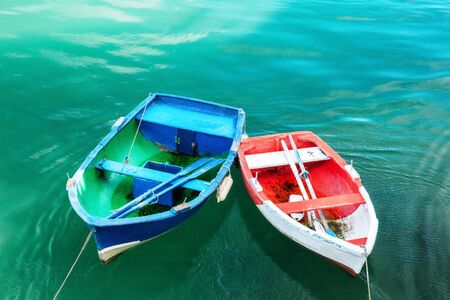 Vibrant small boats in Cantabria with copy spaceの写真素材