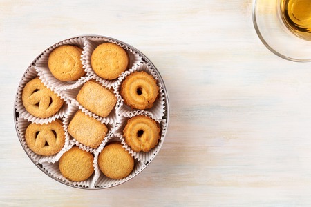 Overhead view of Danish butter cookies with tea and copyspaceの写真素材