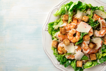 Overhead photo of shrimp Caesar salad with copyspaceの写真素材