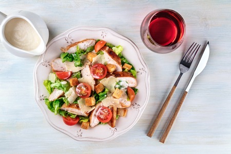 Chicken Caesar salad on light background with copyspaceの写真素材