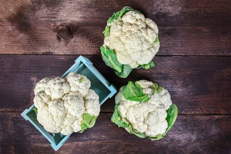 Cauliflowers on rustic textures with copy spaceの写真素材