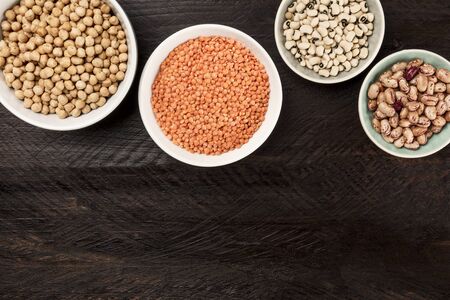 Legumes on dark background, from above with copy spaceの写真素材
