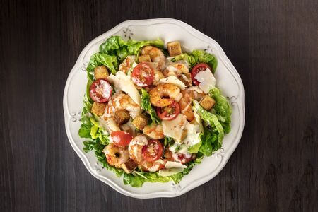 Overhead photo of shrimp Caesar salad with copyspaceの写真素材
