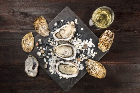 Overhead photo of oysters with wine and copy spaceの写真素材