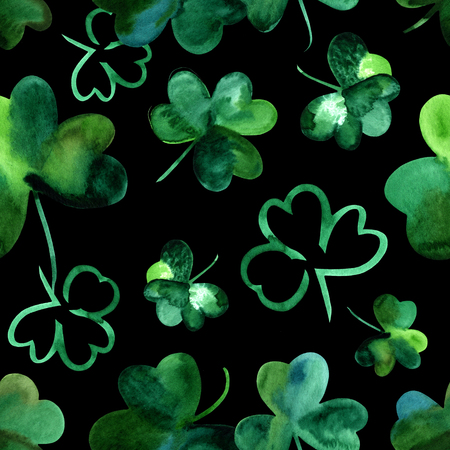 Seamless background pattern, watercolour shamrocks on blackの写真素材