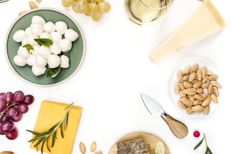 Selection of cheeses on white with copy spaceの写真素材