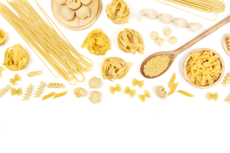 Overhead photo of different types of pasta on white with copy spaceの写真素材