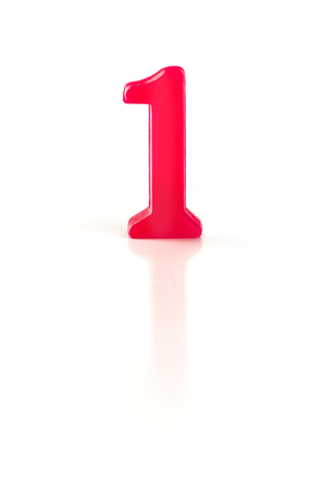 Red number one on a white background with copyspaceの写真素材