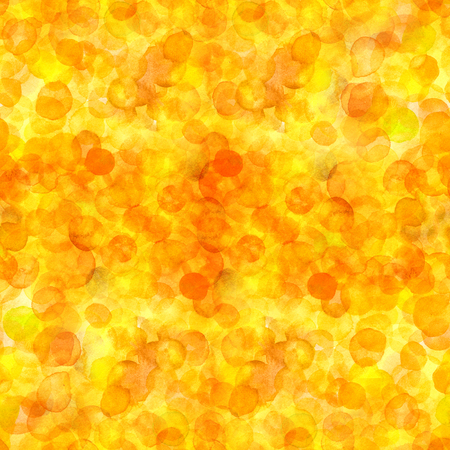 A seamless pattern of yellow and orange watercolor dots. A hand drawn repeat print, an abstract backgroundの写真素材