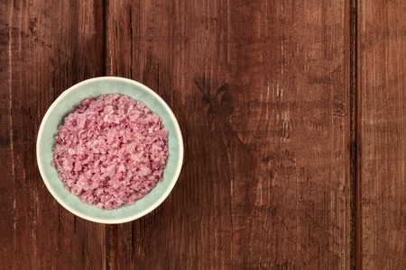 Pink Himalayan sea salt, shot from above on a dark rustic wooden background with copy spaceの写真素材
