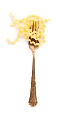 Italian pasta design element. A fork with fusilli, shot from the top on a white backgroundの写真素材