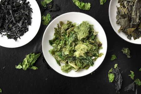 Dry seaweed, sea vegetables, close-up overhead shot on a black backgroundの写真素材