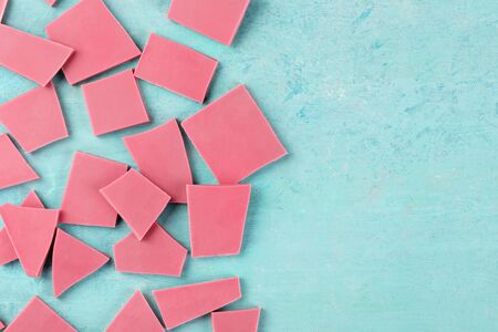 Ruby chocolate, shot from the top on a blue background with a place for textの写真素材