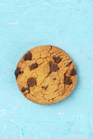 Chocolate chip cookie, gluten-free, overhead shot on a blue background with a place for textの写真素材
