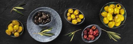 Olives variety panorama, an overhead flat lay shot on a dark backgroundの写真素材