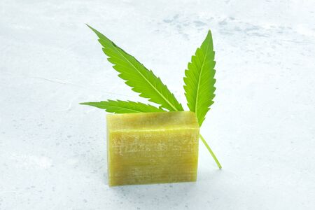 Cannabis soap bar with a cannabis leaf and a place for textの写真素材