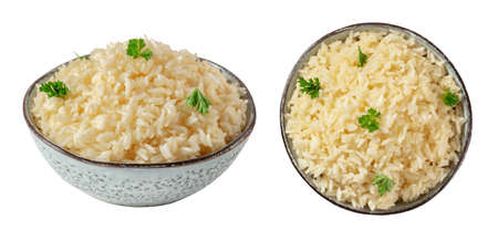 Rice set. Rice, cooked, in a bowl with fresh parsley leaves, isolated on a white backgroundの写真素材