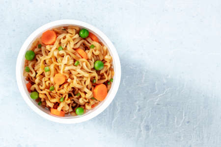 Instant noodles in a plastic cup, shot from above with copy spaceの写真素材