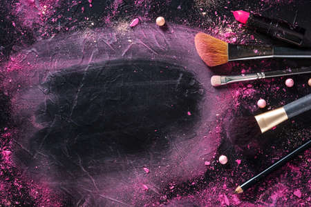 Make-up background with brushes and pearls. Makeup products and toolsの写真素材