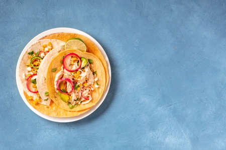 Tacos with chicken, cheese and avocado, shot from the topの写真素材